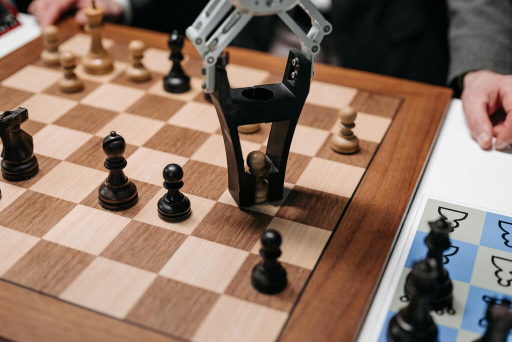 Robotic arm playing a strategic chess game on a wooden board, showcasing technology and innovation.